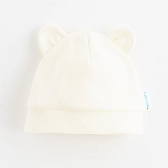 New Baby bézs pamut baba sapka fülekkel, rugalmas szegéllyel, 74-es méret (6-9 hónap). Kényelem minden kisbabának!